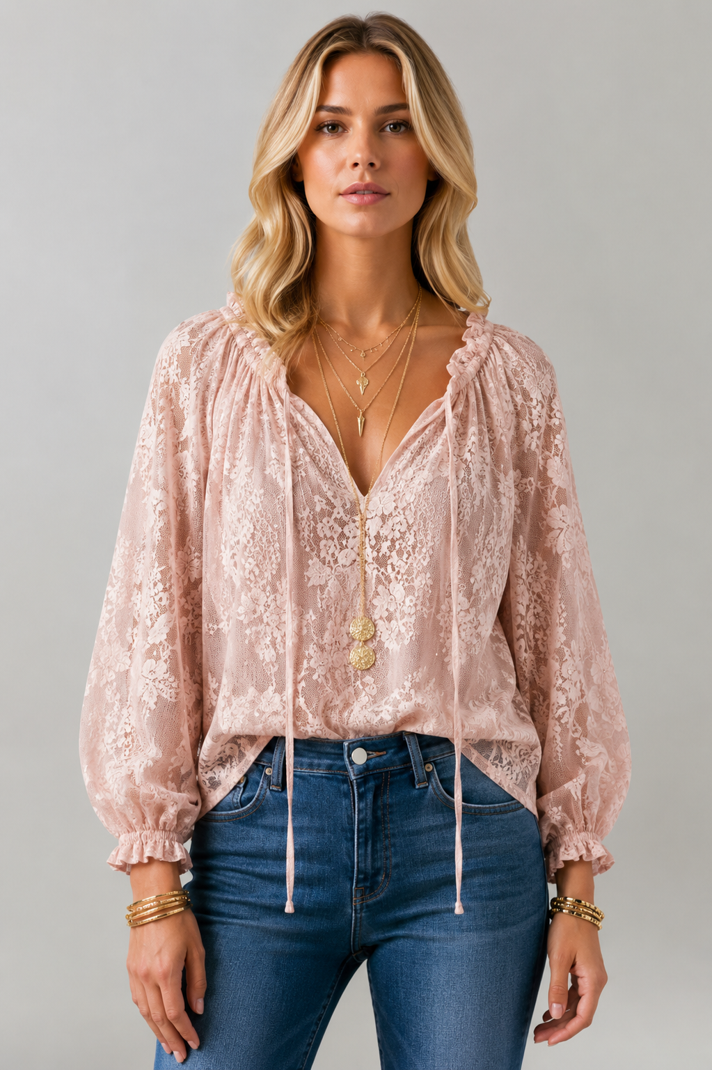 Close-up of a women's lace blouse with intricate lace detail & a stylish tied neckline. Feminine shirt.