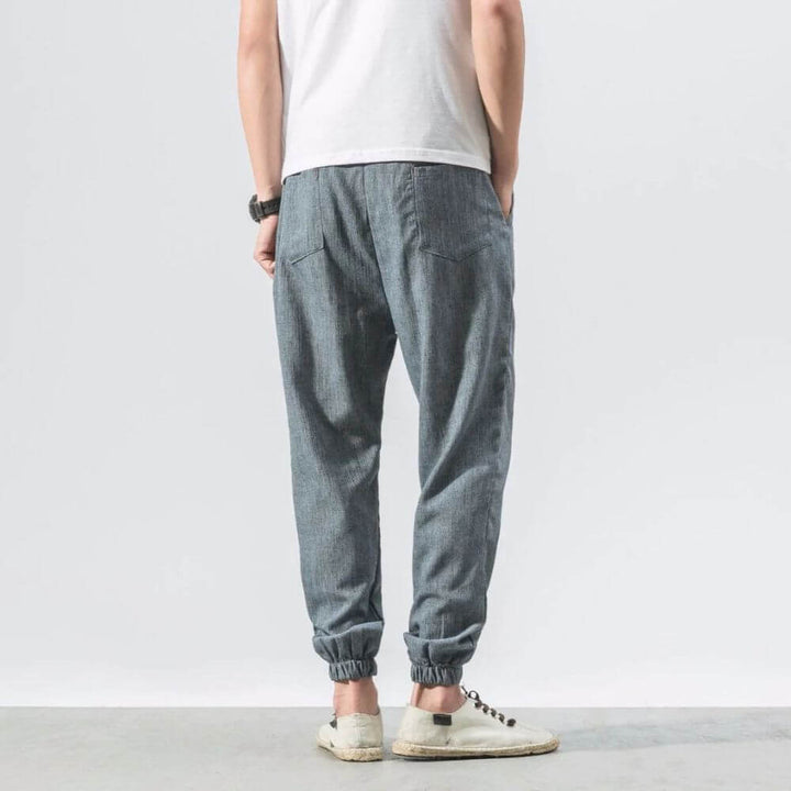 Relaxed fit men's summer pants, breathable fabric, easygoing style.