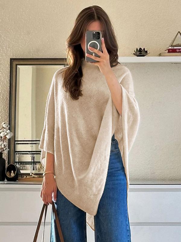 Comfortable beige women's knit cape, featuring an elegant draped and asymmetrical design, ideal for versatile outerwear.