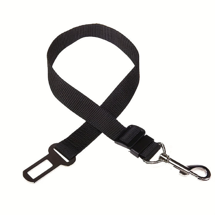 Adjustable black nylon pet seat belt for car safety, keeping dogs and cats secure during travel.