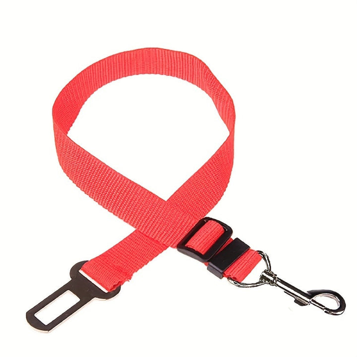 Pet car safety restraint, adjustable nylon seat belt for dogs and cats, ensuring vehicle security.