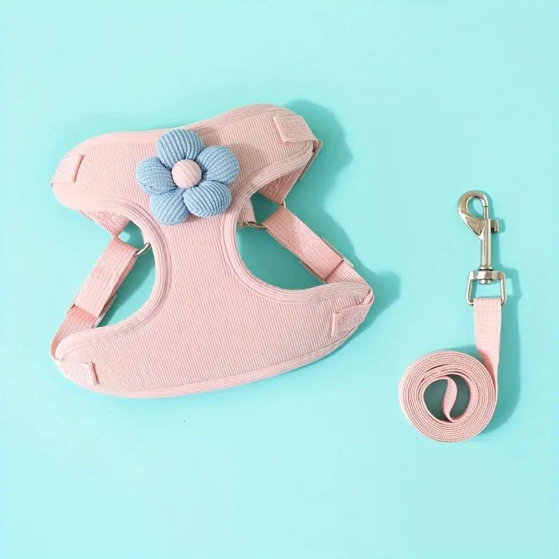 Adjustable no-pull dog harness in black with a strong handle for control, paired with a leash