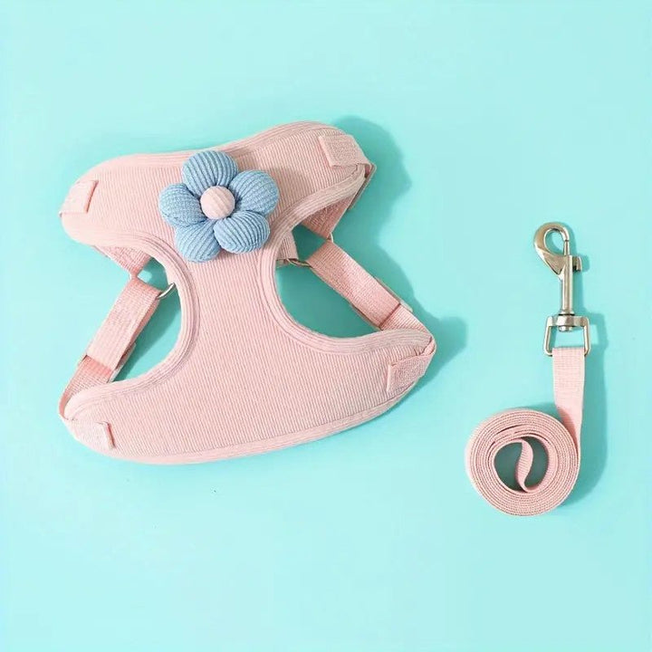 Adjustable no-pull dog harness in black with a strong handle for control, paired with a leash