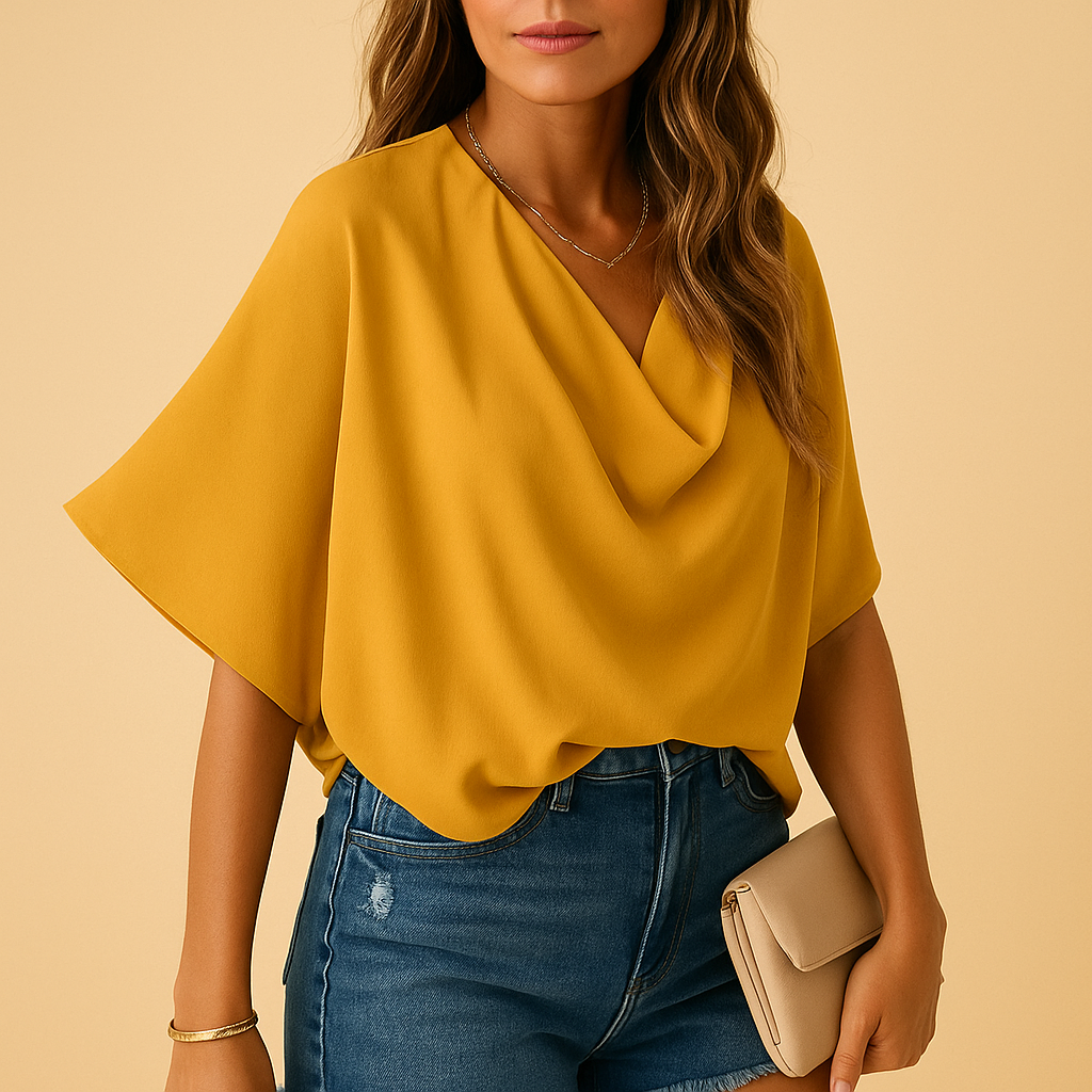Relaxed fit women's batwing sleeve blouse, an airy and stylish v-neck top for comfortable everyday wear.