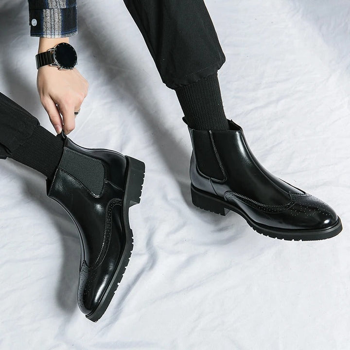 Elegant men's dress chelsea boots, offering comfort and style with refined brogue elements.