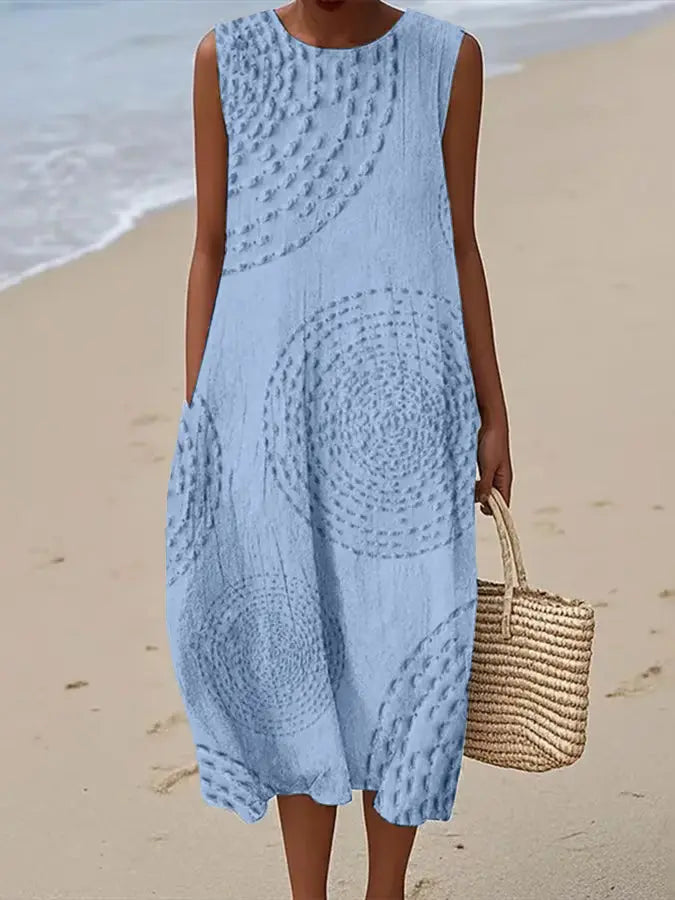 Elegant women's sleeveless midi dress featuring intricate floral embroidery, A-line cut for a modest, graceful style.