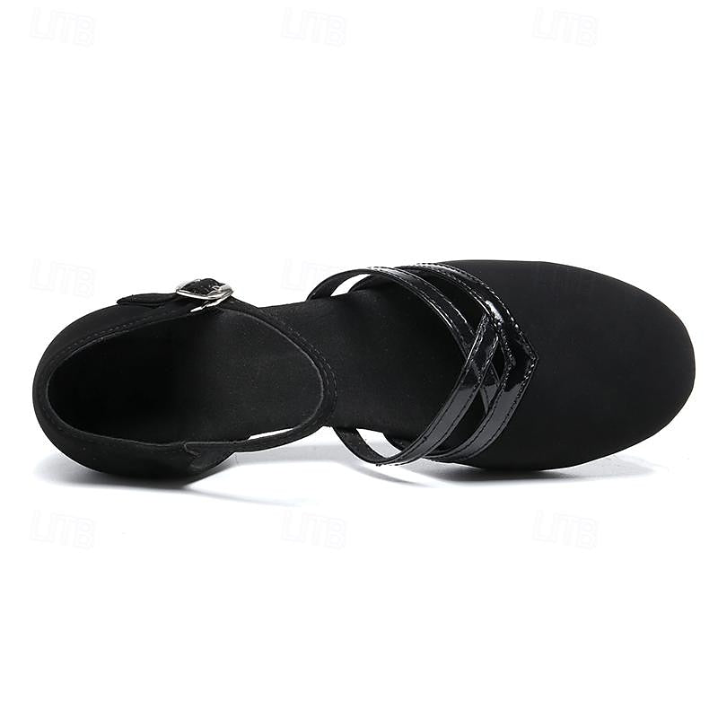 Women's black dance shoes, elegant footwear with ankle strap, round toe, & stable heel for graceful performance.