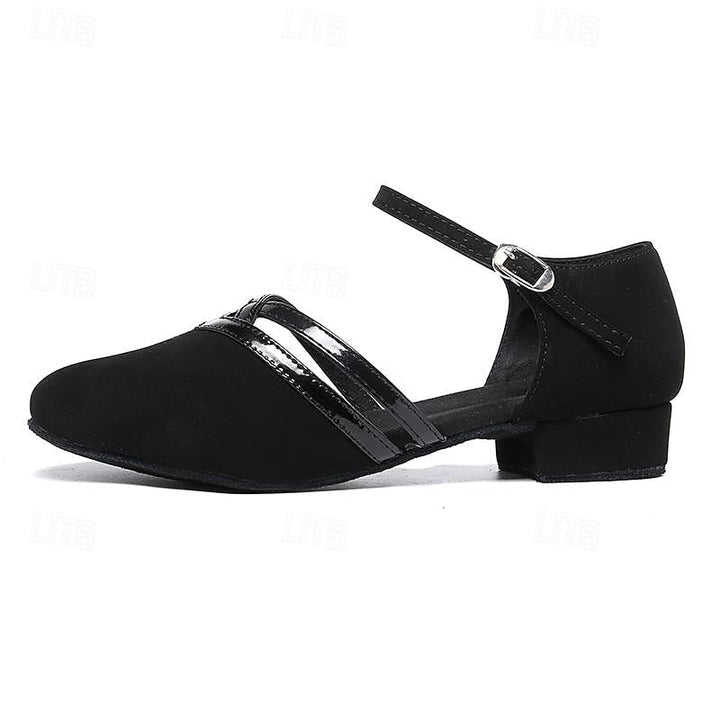 Graceful women's black dance shoes with a comfortable ankle strap, stable heel, and round toe for elegant movement.