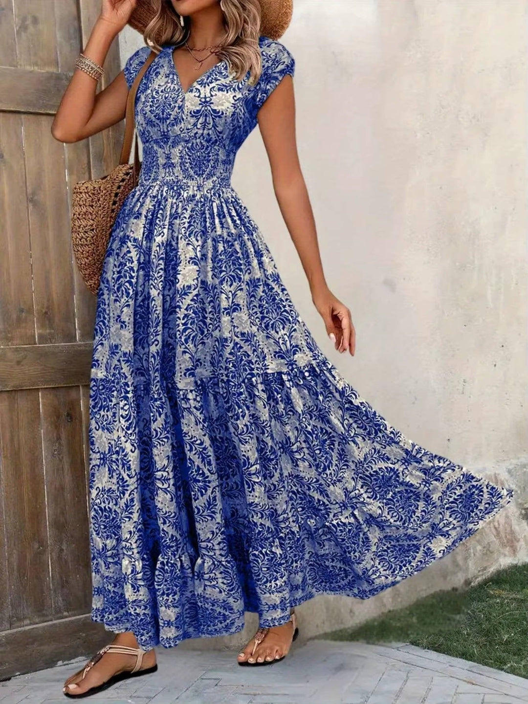 Elegant flowy maxi dress for women. V-neck bohemian style, perfect for summer fashion & resort wear.