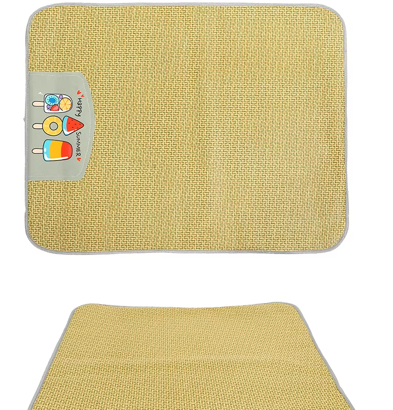 A small dog comfortably resting on a rectangular rattan pet cooling mat, perfect for summer.