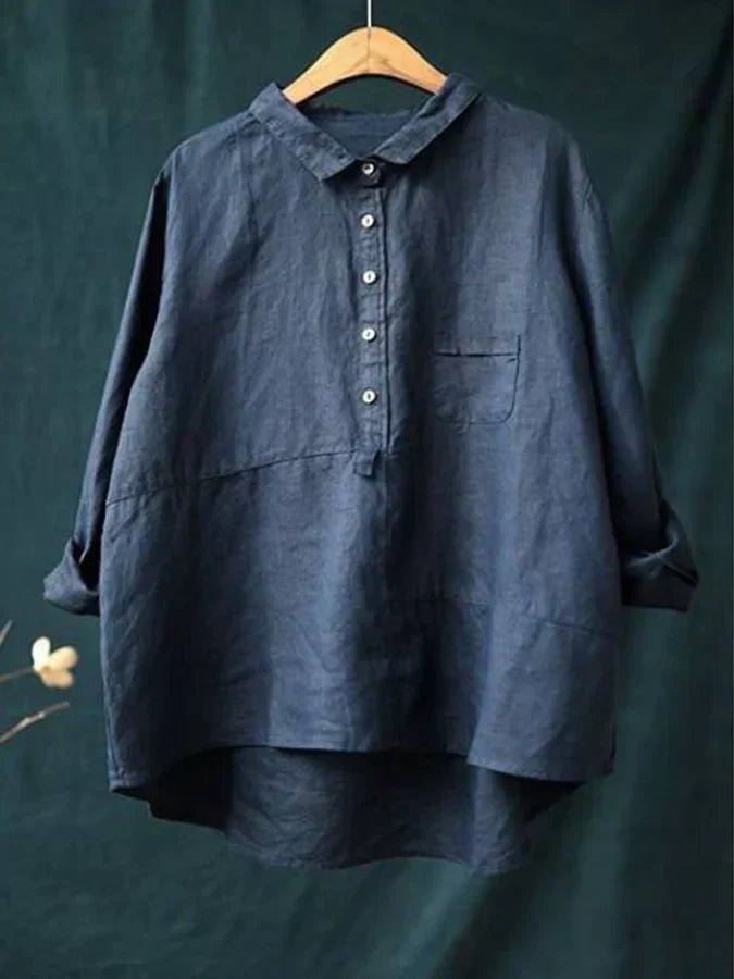Chic women's oversized high-low button-down shirt. Fashionable long sleeve blouse for modern casual wear.