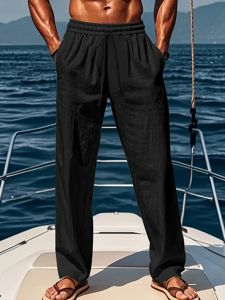 Comfortable men's chino trousers, loose fit with elastic drawstring waist for versatile wear.