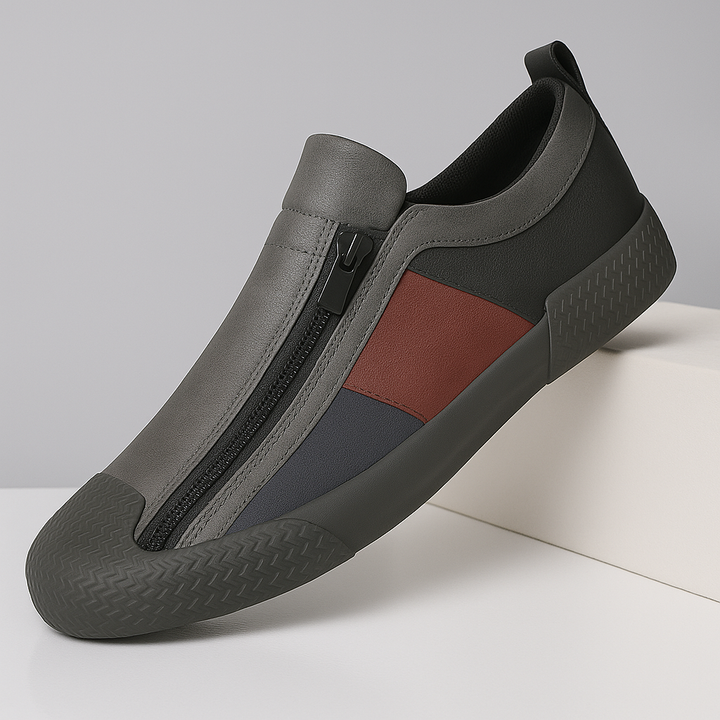 Men's color block sneakers on foot, demonstrating comfortable fit & modern style.