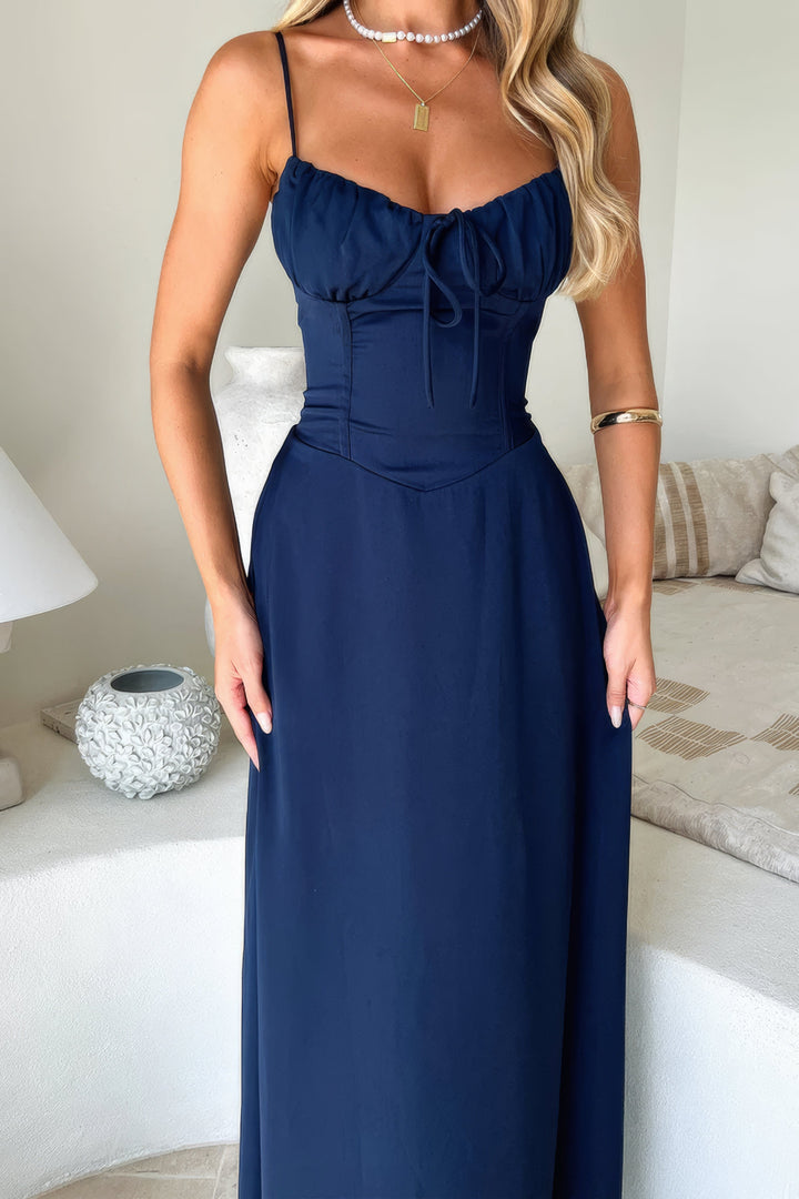 Charming sleeveless A-line maxi dress for women, featuring a stylish tie-front. Perfect for vacation.