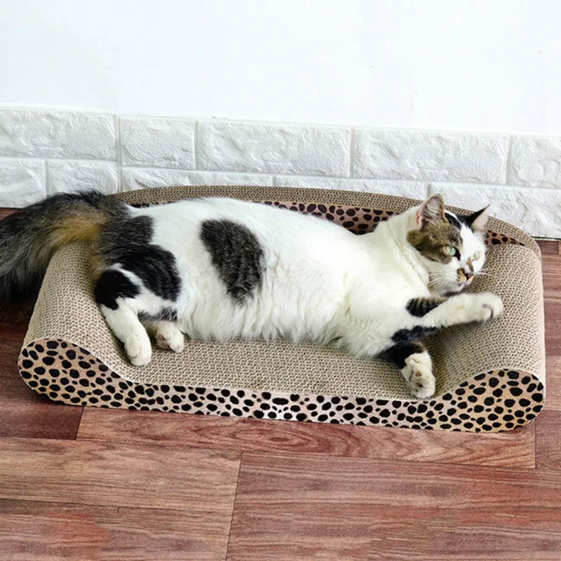 Cat leopard print scratching mat with a cat peacefully sleeping on its soft surface, protecting furniture.