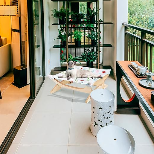 Cat wooden lounger with colorful striped cover, a cozy pet bed for comfort.