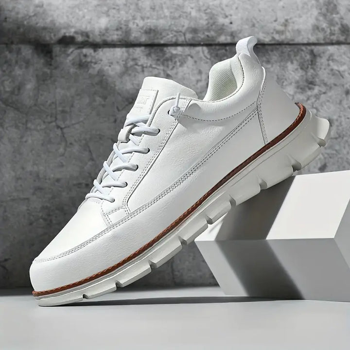 Stylish low-top mens sneakers. Versatile casual shoes offering everyday comfort for smart casual outfits.