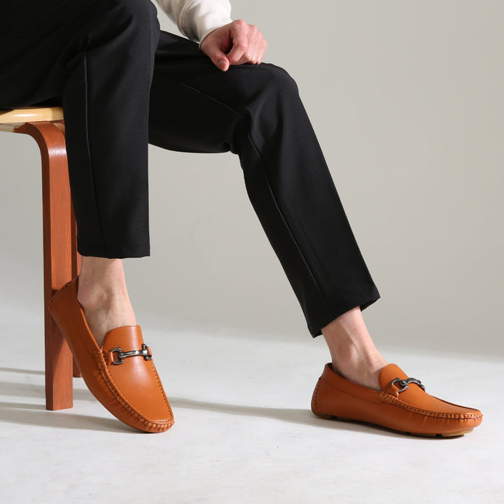 Stylish brown men's slip-on loafers, ideal for professional office wear or sophisticated evening events. Comfortable dress shoes.