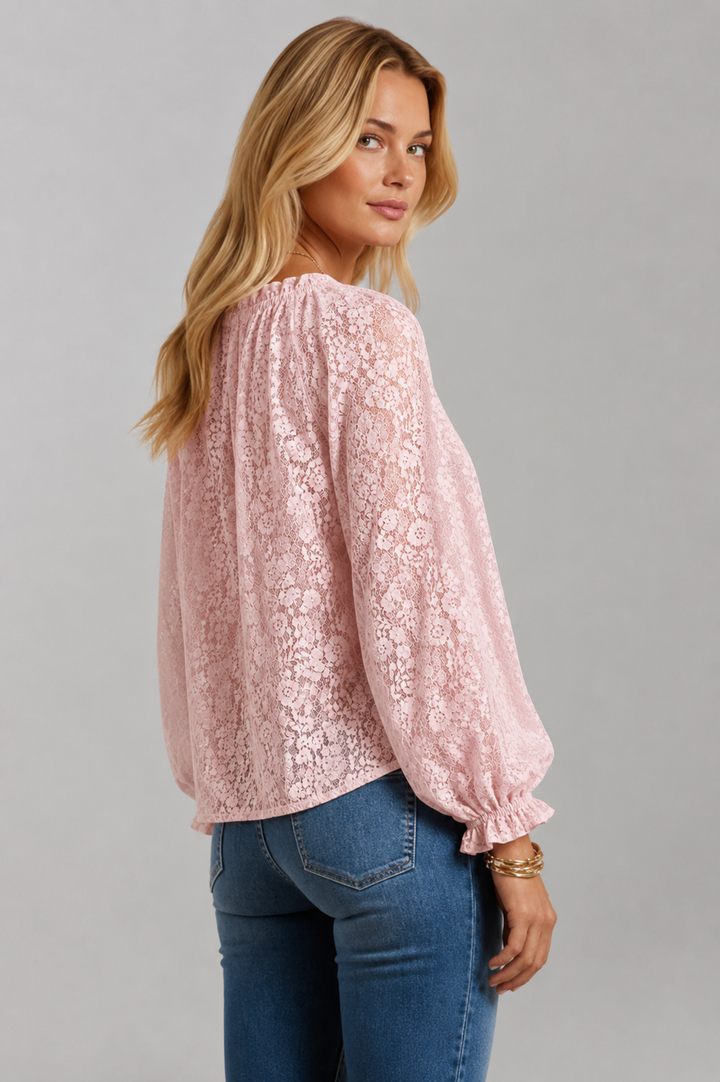 Women's sophisticated lace blouse with a graceful tied neckline. Long sleeve, flowy, and elegant apparel.