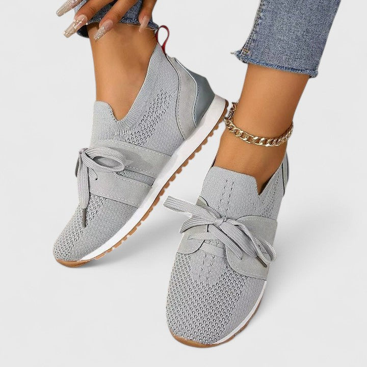 Orthopedic women's slip-on sneakers with arch support for foot relief and comfortable daily wear.