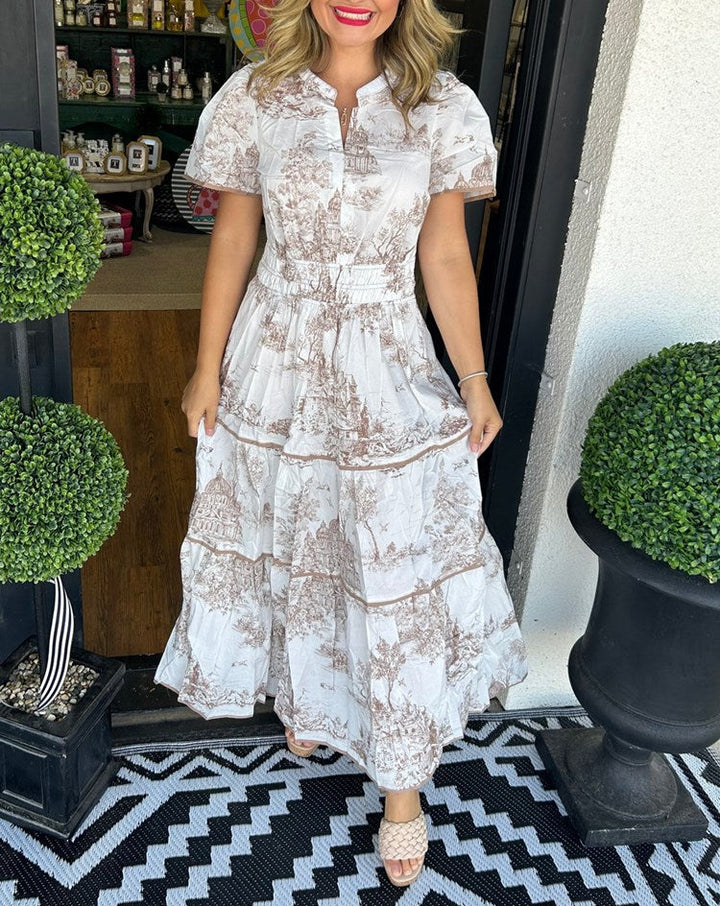 Beautiful women's wedding guest maxi dress. Toile print, tiered design, puff sleeves for an elegant look.