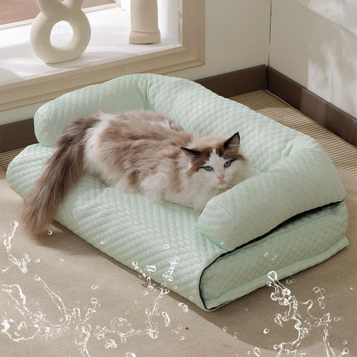 Large blue cooling mat for pets, serving as a couch protector for dogs & cats.