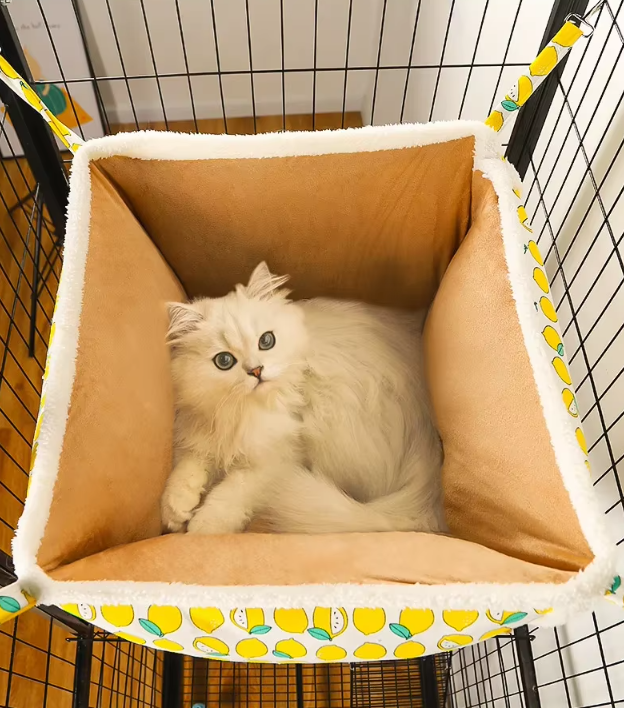 Cozy cat bed with cute paw print pattern, soft plush, and enclosed design for feline comfort.