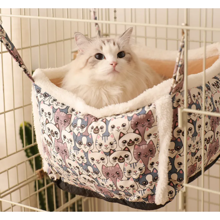 Plush cat bed with an adorable animal pattern, perfect for a relaxing and warm sleeping spot.
