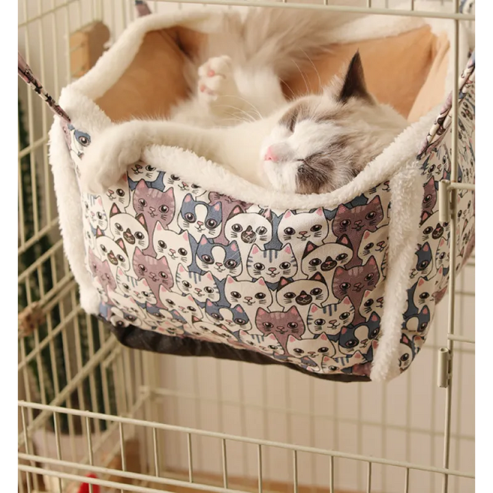 Enclosed cat sleeping basket, soft and patterned, offering a private and secure retreat for pets.