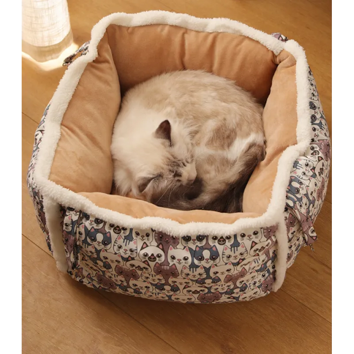 Round cat bed with a cozy cave shape and playful paw print pattern, ideal for deep sleep.