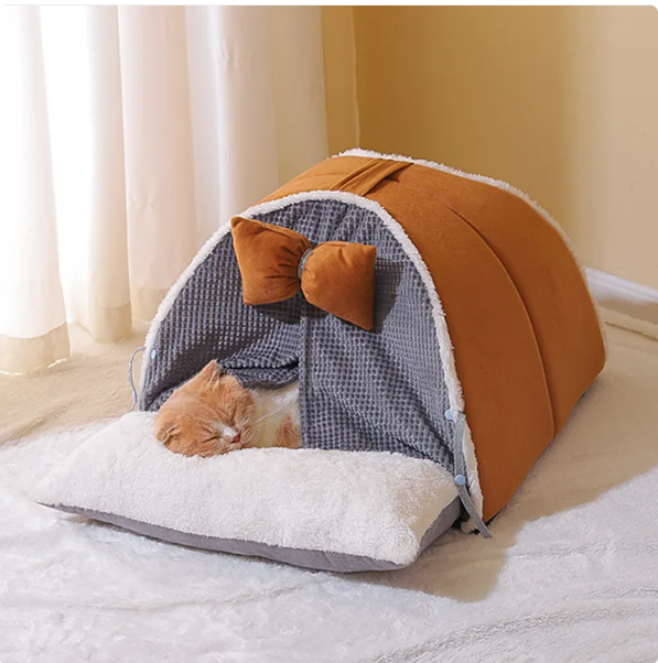 Cozy cat cave bed in milky yellow with an elegant arch design and a decorative bow, perfect pet furniture.