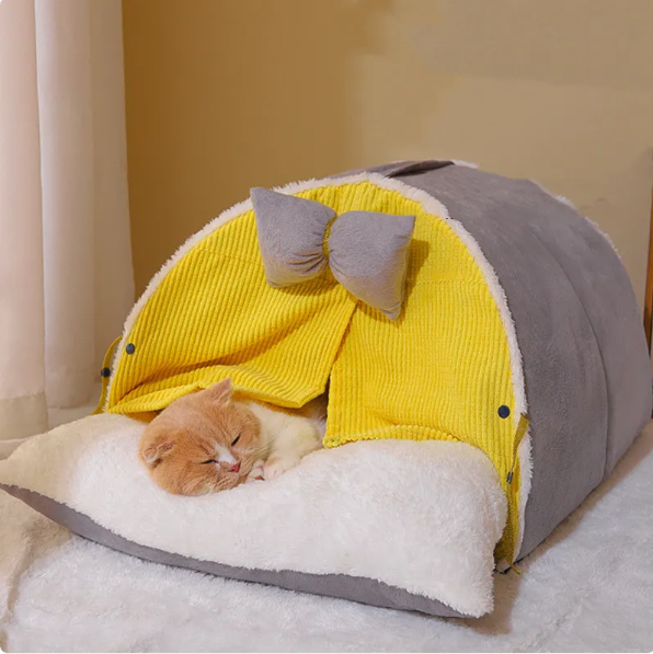 Milky yellow cat bed with modern arch design & cute bow, a comfy cat house for a feline retreat.