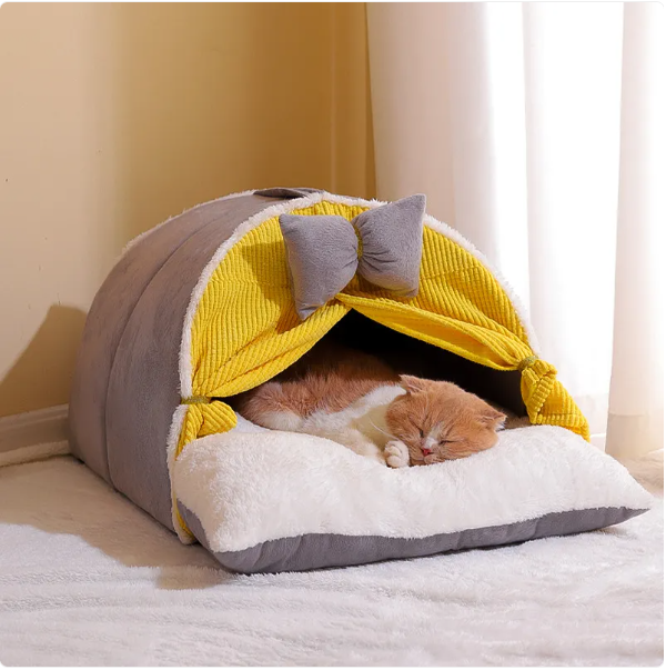 Stylish cat cave bed, milky yellow with coffee accents, features an arch design & bow for ultimate cat comfort.