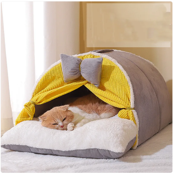 Soft milky yellow cat bed with an inviting arch design and adorable bow, ensuring a purrfect cat retreat.