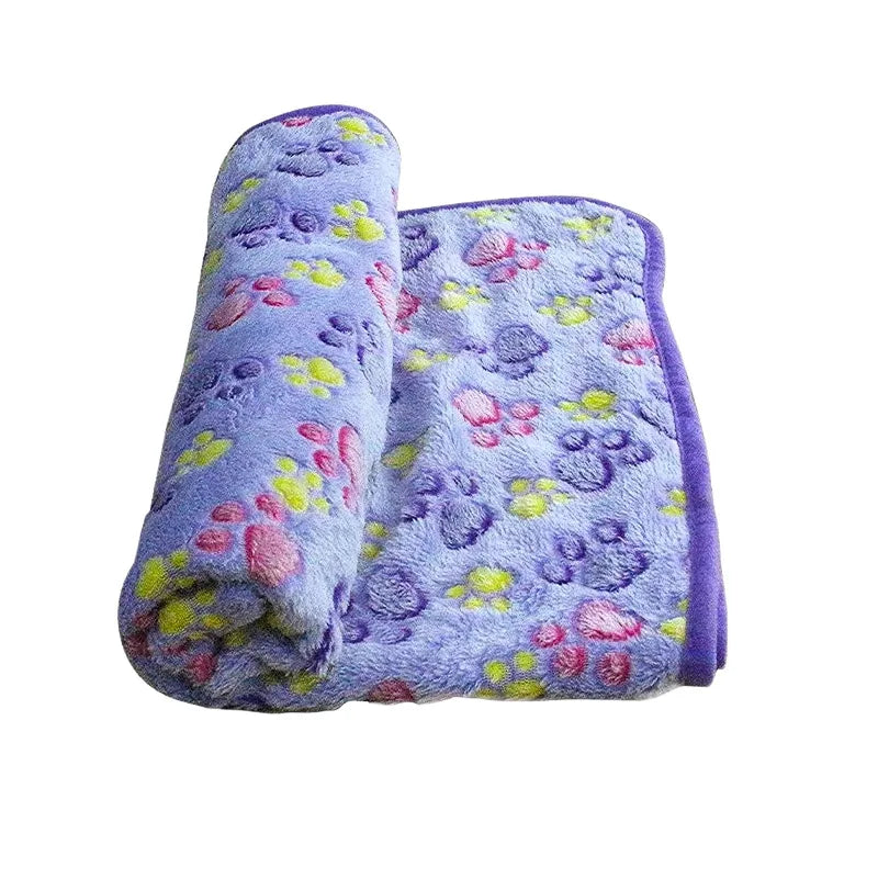 Cozy coral fleece pet blanket in a neutral color, perfect for dogs and cats, providing soft comfort.