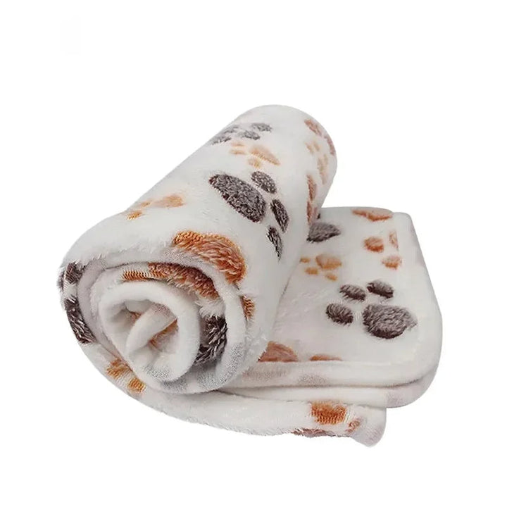 Compact coral fleece pet blanket, ideal as a travel blanket or crate mat for small to medium pets.