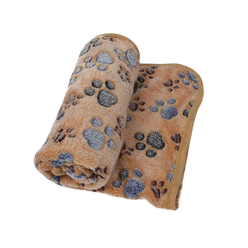 Lightweight and cozy coral fleece pet blanket, offering a soft spot for cats and dogs to rest.