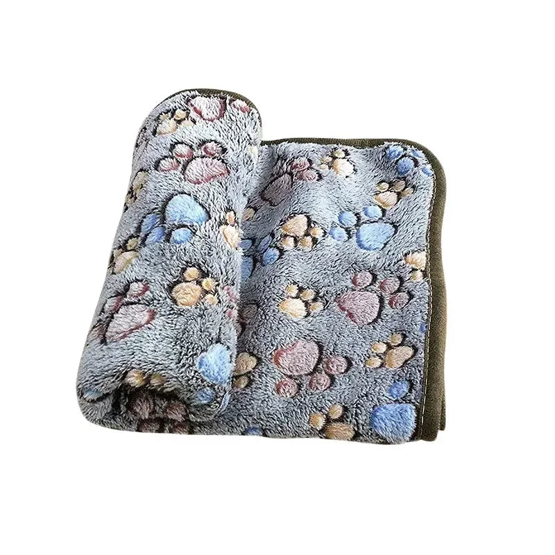 Durable coral fleece blanket in a cute pattern, providing a cozy and warm spot for your beloved pet.