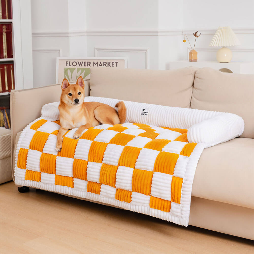 Cozy plaid pet mat on a grey sofa, protecting furniture from dog hair, anti-slip base.