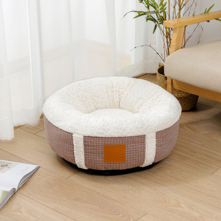 Cozy plush pet bed for cats and small dogs, promoting calming sleep in winter.