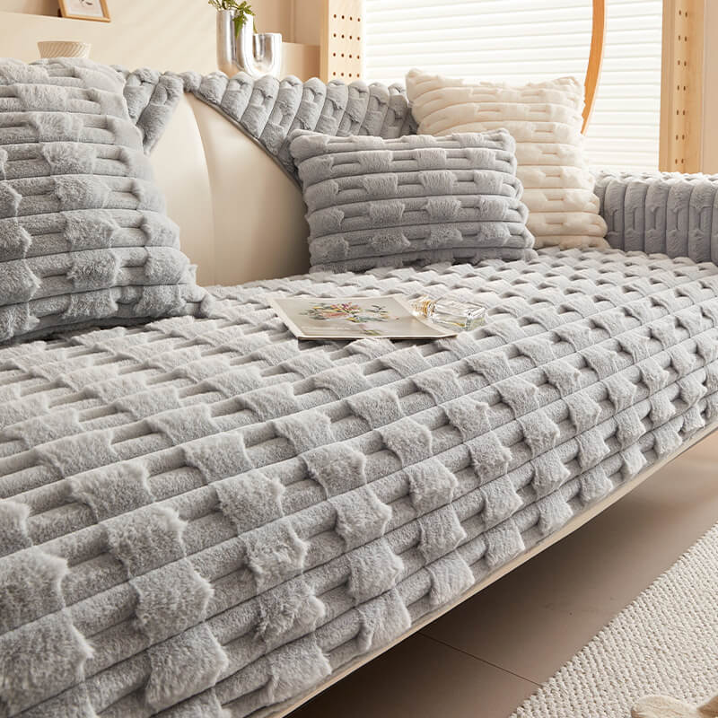 Contemporary striped couch cover in plush material, providing both style and long-lasting protection for sofas