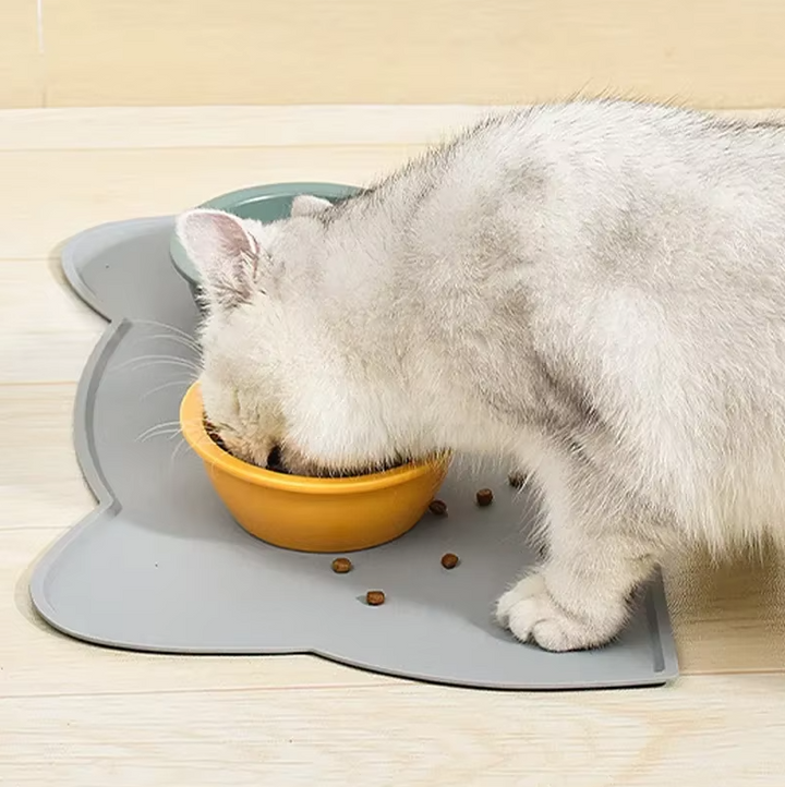 Practical cat accessory: a cat-shaped silicone non-slip mat for pet bowls, easy to clean and maintain.
