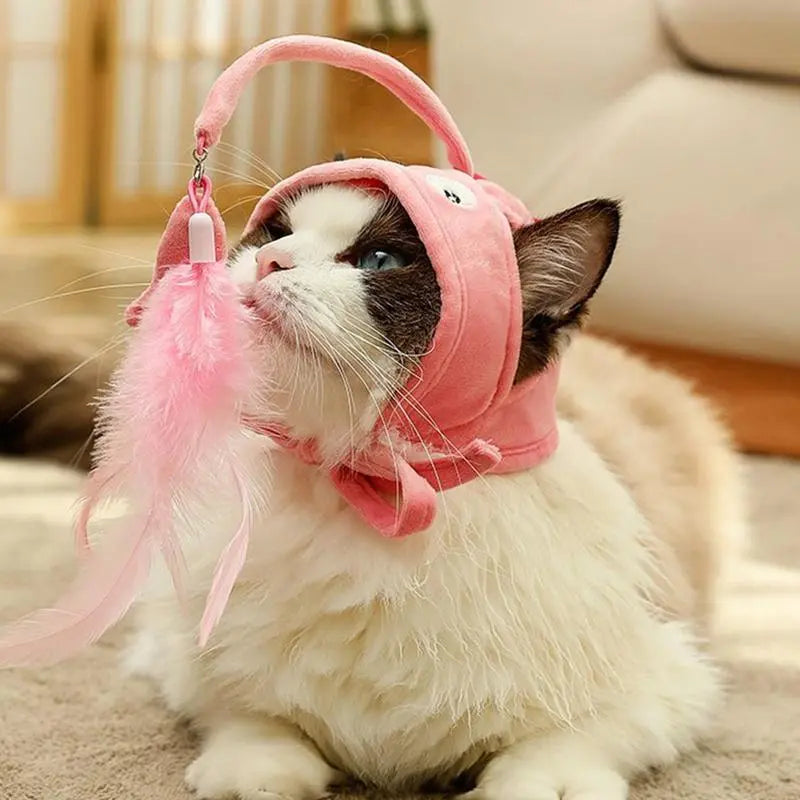 Cute cat wearing a pet hat with a playful feather pendant toy, interactive cat toy.
