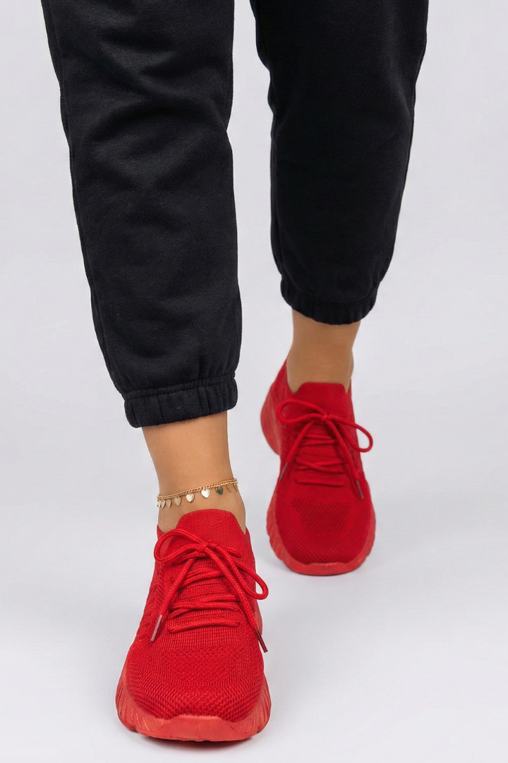 Woman wearing comfortable lace-up athletic sneakers, perfect for everyday walking & light sports.