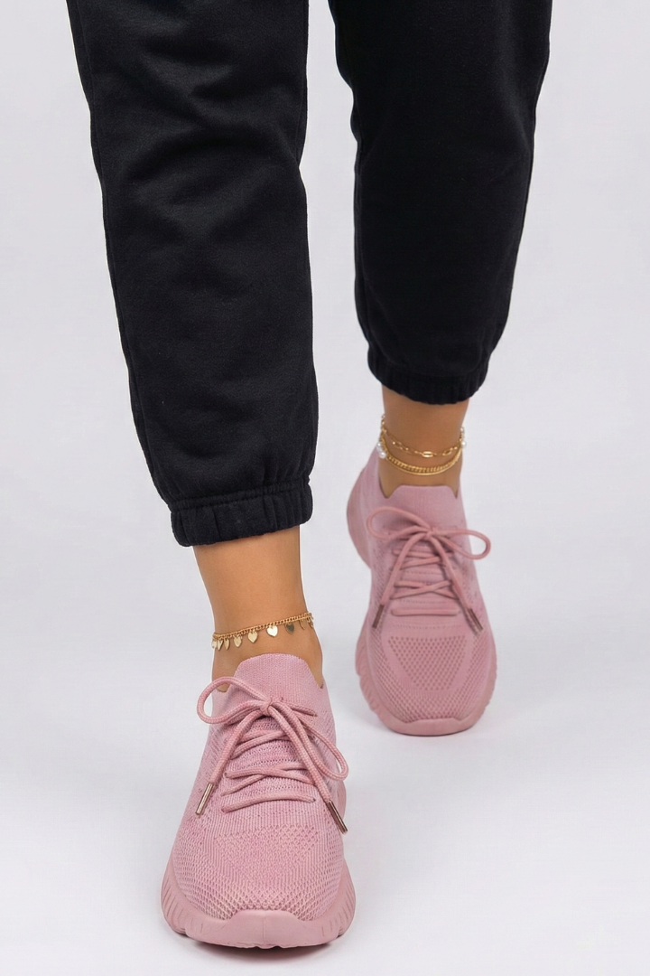 Lightweight women's lace-up sneakers, offering everyday comfort and support for casual and active lifestyles.