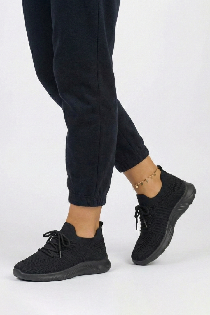 Stylish women's everyday sneakers with a lace-up design, modern aesthetic, and textured sole.