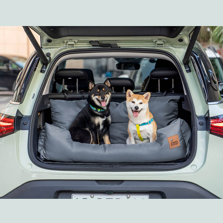 Large dog car safety seat with bolster design, comfortable and secure for travel.