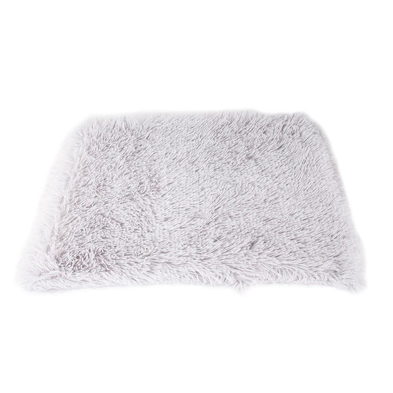 Calming pet blanket draped over a sofa, protecting upholstery while offering comfort for a dog or cat