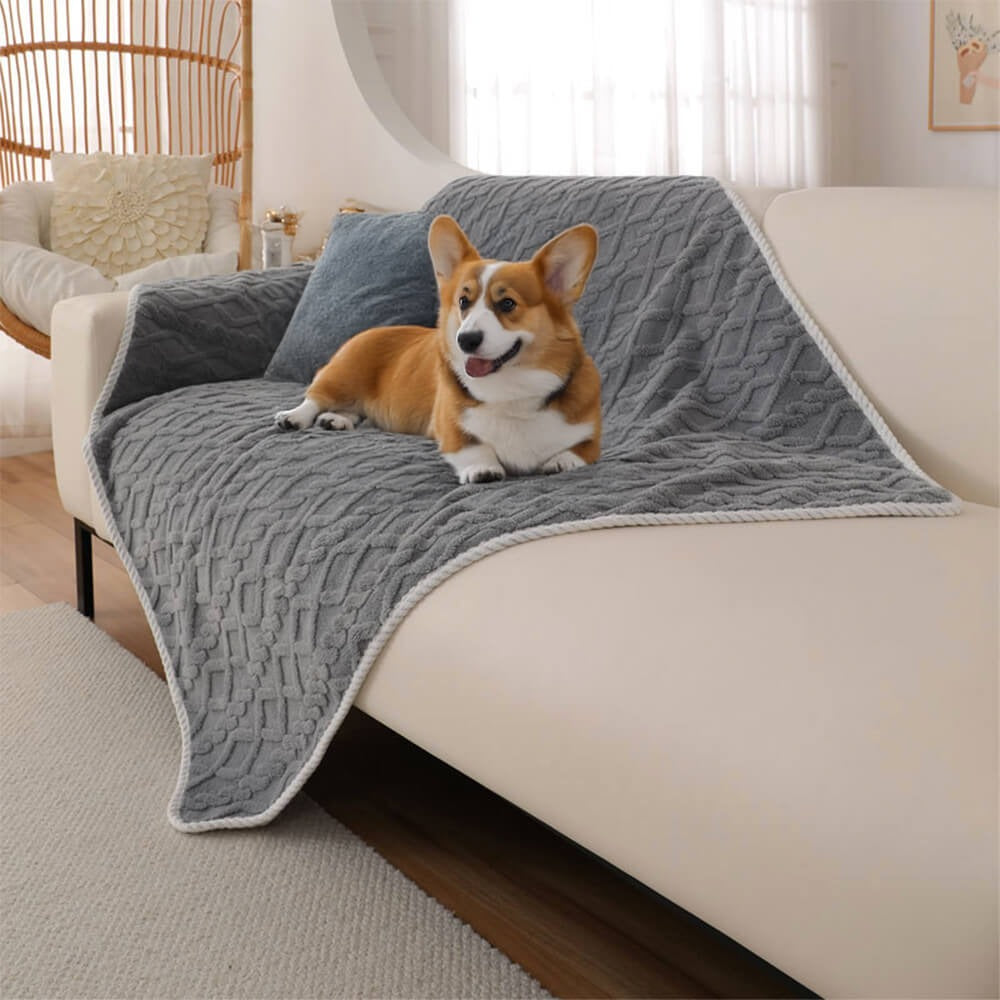Soft gray fleece dog blanket, waterproof & washable, for ultimate pet comfort & furniture protection.