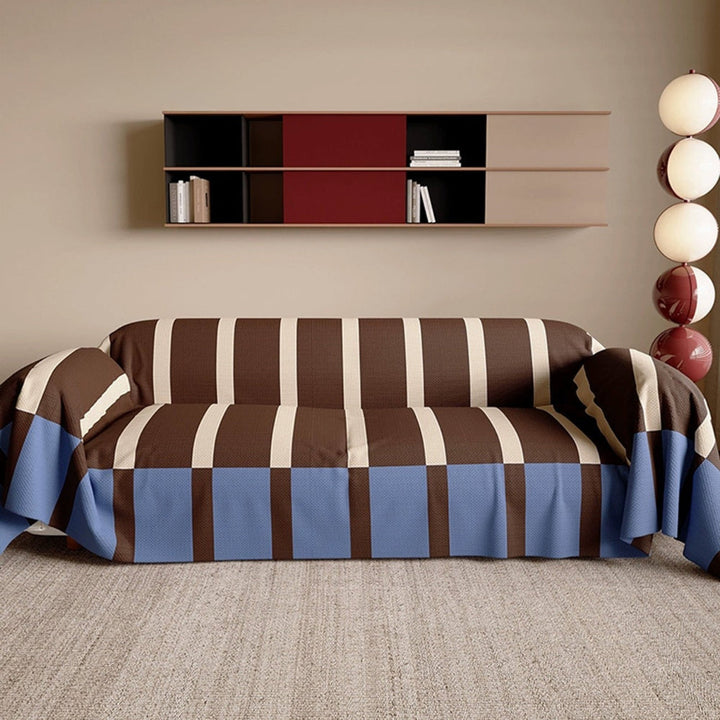 Contemporary striped sofa cover. Memphis style couch protector for a modern, pet-friendly living room.